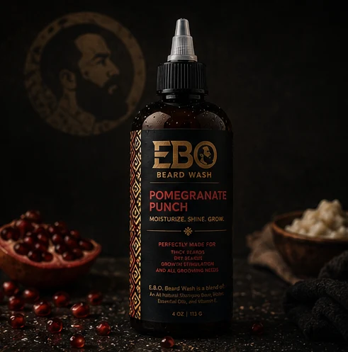 EBO Beard Wash — Pomegranate Punch jar photographed on black with gold light